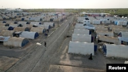 An aerial view shows a Jadah camp for refugees and displaced people in Qayyara, Iraq, April 7, 2023.