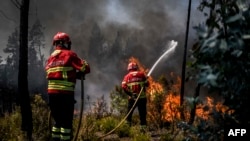 Firefighters battle a wildfire in Carrascal, Proenca a Nova on Aug. 6, 2023. More than 1,000 firefighters battled a wildfire in Portugal as officials warned that thousands of hectares were at risk amid soaring temperatures across the country. 