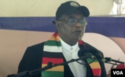 Zimbabwe's Vice President Constantino Chiwenga addresses demonstrators rallying against sanctions imposed on Zimbabwe, Oct. 25, 2023, in Harare. (Columbus Mavhunga/VOA)