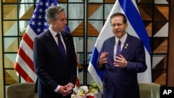US Secretary of State Antony Blinken, left, and Israeli President Isaac Herzog talk in Tel Aviv, Israel, May 1, 2024.