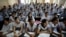 FILE - In this Aug. 5, 2010, photograph, students attend an entrance-exam class in Kota, India.