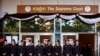 FILE - Thai police officers stand guard outside the Supreme Court in Bangkok, Sept. 27, 2017. 