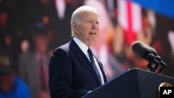 President Joe Biden delivers a speech during a commemorative ceremony to mark D-Day 80th anniversary, June 6, 2024, at the U.S. cemetery in Colleville-sur-Mer, Normandy, France.