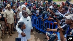 Sierra Leone President Julius Maada Bio speaks to reporters after casting his ballot in the country's general elections, in Freetown, June 24, 2023.