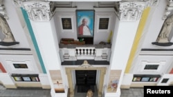 An Image of Pope John Paul II is seen on the Basilica of the Presentation of the Blessed Virgin Mary in Wadowice, the birth place of Pope John Paul II, Poland, March 15, 2023. 