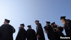 Graduating students gather for commencement ceremonies at Boston College in Chestnut Hill, Massachusetts, May 22, 2023. 