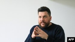 FILE - Leonid Volkov, a close ally of late Russian opposition leader Alexei Navalny, speaks during an interview with AFP, in Vilnius on March 2, 2021. Volkov was attacked outside his home in Lithuania and hospitalized. 
