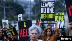 FILE - People attend a protest demanding the release of hostages kidnapped in the deadly October 7 attack on Israel by the Palestinian Islamist group Hamas from Gaza, in Tel Aviv, Israel, April 8, 2024. 