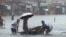 Streets flood from monsoon rains worsened by offshore Typhoon Gaemi in Manila, Philippines, July 24, 2024. The storm has already left several dead in the Philippines and is expected to drench China after passing over Taiwan.