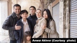 Nilufar and Anwar Akhror with their four children on family vacation in February 2023, in Venice, Italy.