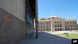 FILE - The Arizona Senate building at the state Capitol stands, April 11, 2024, in Phoenix. The state Senate voted on May 1, 2024, to repeal the state's 1864 ban on abortion. 
