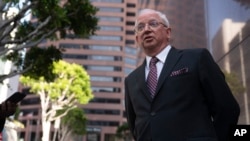 FILE - Attorney John Eastman, the architect of a legal strategy aimed at keeping former President Donald Trump in power, talks to reporters after a hearing in Los Angeles, June 20, 2023.