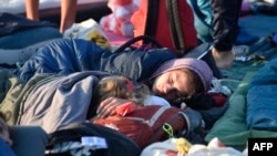 Pilgrims sleep in Tejo Park ahead of the closing mass of the World Young Day (WYD) celebrated by the pope, Lisbon, on Aug. 6, 2023
