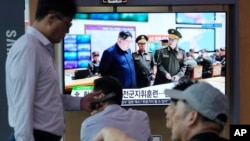 A TV shows an image of North Korea's Kim Jong Un during a news program at the Seoul Railway Station in Seoul, South Korea, Aug. 31, 2023. North Korea fired several cruise missiles toward the Yellow Sea on Sept. 2, 2023, the South Korean military said.