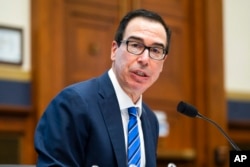 FILE - Treasury Secretary Steven Mnuchin testifies on Capitol Hill in Washington, Dec. 2, 2020.