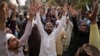 FILE - Protesters rally against a woman arrested on blasphemy charges in Lahore, Pakistan, April 17, 2023. Officials in northwest Pakistan said June 20, 2024, that a crowd stormed a police station, took a detainee facing blasphemy charges and killed him.
