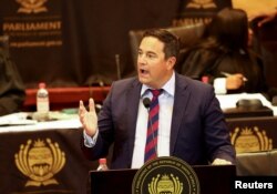 FILE - Opposition Democratic Alliance party leader John Steenhuisen speaks at South Africa's parliament debate, in Cape Town, South Africa, Dec. 13, 2022.