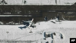 This satellite image from Maxar Technologies shows a Beriev A-50 early warning aircraft, center, at Machulishchy Air Base near Minsk, Belarus, Feb. 28, 2023.