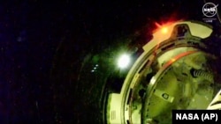 Boeing Starliner spacecraft prepares to dock, for the first time, with the International Space Station, June 6, 2024. (NASA via AP)