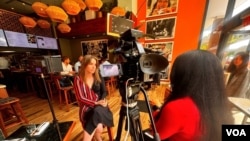 Téa Ivanovic, left, is one of Immigrant Food’s co-founders and moved to the U.S. from Belgium as an international student. (Screen grab from video by Saqib Ul Islam/VOA)