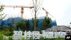 The Country Garden One World City project under construction is seen on the outskirts of Beijing, Aug. 17, 2023. China's government is trying to reassure jittery homebuyers after the major real estate developer missed a payment on its debt.