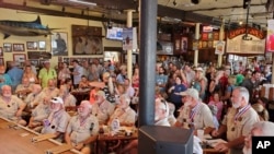 Former Hemingway Look-Alike Contest winners prepare to judge the 2024 contest at Sloppy Joe's Bar in Key West, Florida, July 18, 2024.