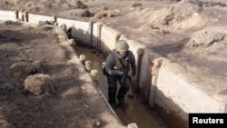 Ukrainian soldiers are taught trench warfare techniques by British army instructors at a secret military base in the north of England, Feb. 16, 2023.