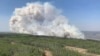 FILE - In this photo provided by the Government of Alberta Fire Service, a wildfire burns a section of forest in the Grande Prairie district of Alberta, Canada, May 6, 2023. Canadian officials have asked other countries for help fighting wildfires.