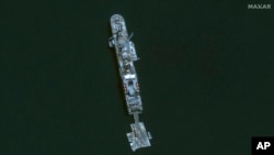 This image released by Maxar Technologies shows the USNS Roy P. Benavidez at the new pier off Gaza, May 18, 2024. (Satellite image ©2024 Maxar Technologies via AP)