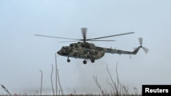FILE — A Russian Mi-8 military helicopter being tested by the Russian Air Force of the Southern Military District in the Rostov region, Russia, Jan. 19, 2022. Ukraine's GUR military intelligence say it lured a Russian military pilot to land his Mi-8 at a Ukrainian airfield.