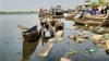 Trash and rotten boards litter the Nile River, in Bor, Jonglei State, South Sudan.