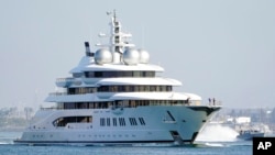 FILE - The superyacht Amadea sails into the San Diego Bay June 27, 2022, seen from Coronado, California.