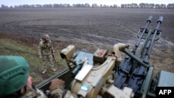 Ukrainian servicemen of Ukrainian Air Defense unit, 241st separate brigade of the Territorial Defense Forces take part in a training in the Kyiv region, Oct. 28, 2023. 