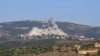 Israel hits Hezbollah targets after rocket strike from Lebanon kills 12