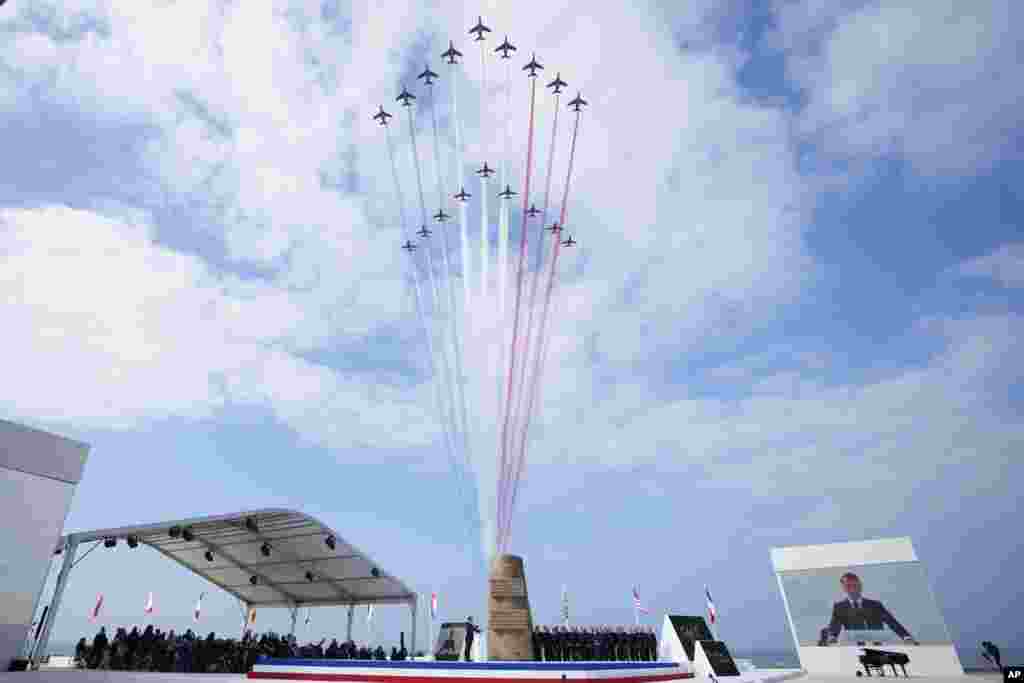 Jets of the Patrouille de France fly over the international ceremony at Omaha Beach in Normandy near Saint-Laurent-sur-Mer.&nbsp;Normandy is hosting various events to officially commemorate the 80th anniversary of the D-Day landings that took place on June 6, 1944.&nbsp;