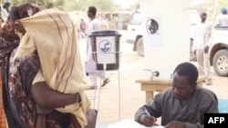 A worker registers Sudanese refugees who crossed into Chad at a camp in Koufroun, near Echbara, on May 1, 2023.