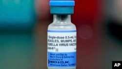 FILE - A vial of a measles, mumps and rubella vaccine is seen in Mount Vernon, Ohio, May 17, 2019.