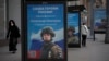 FILE - A billboard shows a picture of a Russian soldier awarded with a medal for his actions in Ukraine, in Moscow, Russia, Nov. 15, 2022.