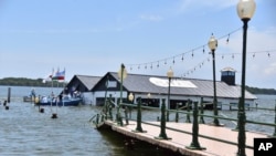 The Marine Museum of Puerto Bolivar, detached from the dock, is partially inundated in water after an earthquake that shook Machala, Ecuador, March 18, 2023.