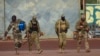 This undated photo provided by the French military shows three Russian mercenaries in northern Mali. 
