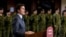 FILE - Canada's Prime Minister Justin Trudeau announces that Canada will send more military equipment and impose additional sanctions on Russian officials on the one-year anniversary of Russia's invasion of Ukraine, at Fort York Armoury in Toronto, Canada, Feb. 24, 2023.