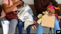 FILE - Children with dengue wait to be seen by doctors at the Mario Ortiz Children's Hospital in Santa Cruz, Bolivia, Feb. 16, 2023. (AP Photo/Ipa Ibanez,File)