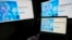 FILE - Screens display the sign-in page of the social media platform X — formerly known as Twitter — July 24, 2023, in Belgrade, Serbia. Rights advocates are urging social media platforms to do more to prevent Chinese authorities from obtaining the personal information of users. 