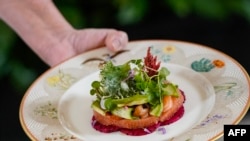 A dish of salmon, avocados, grapefruit, watermelon, radish and cucumber is shown during a media event ahead of the State Dinner for Japan's Prime Minister Fumio Kishida and his spouse Yuko Kishida, at the White House in Washington, DC, on April 9, 2024. (Photo, Drew ANGERER/AFP)