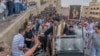 Coptic Bishop Uannas, the head of the Virgin Mary Monastery, blesses believers during a ceremonial procession to the cave church.