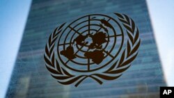 FILE - The symbol of the United Nations is displayed outside the Secretariat Building, Feb. 28, 2022, at U.N. headquarters. The U.N. said April 5, 2023, that it would not comply with a Taliban decree banning Afghan women from working for the organization.
