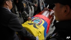 The remains of slain presidential candidate Fernando Villavicencio arrive at Camposanto Monteolivo cemetery for burial in Quito, Ecuador, Aug. 11, 2023. 