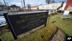 FILE - A sign for toxicologist questions is displayed after a Norfolk Southern derailment in East Palestine, Ohio, Feb. 9, 2023.