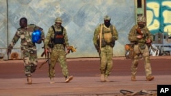 FILE - This undated photo from the French military shows three Russian mercenaries, right, in Mali. Russia's Wagner Group, a now defunct private military company, had played a key role in Russia's invasion of Ukraine, and also deployed personnel to the Middle East and Africa.