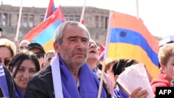 Armenians rally to demand Prime Minister Nikol Pashinyan's resignation over land transfer to neighboring Azerbaijan, at the central Republic Square in Yerevan on May 26, 2024. 